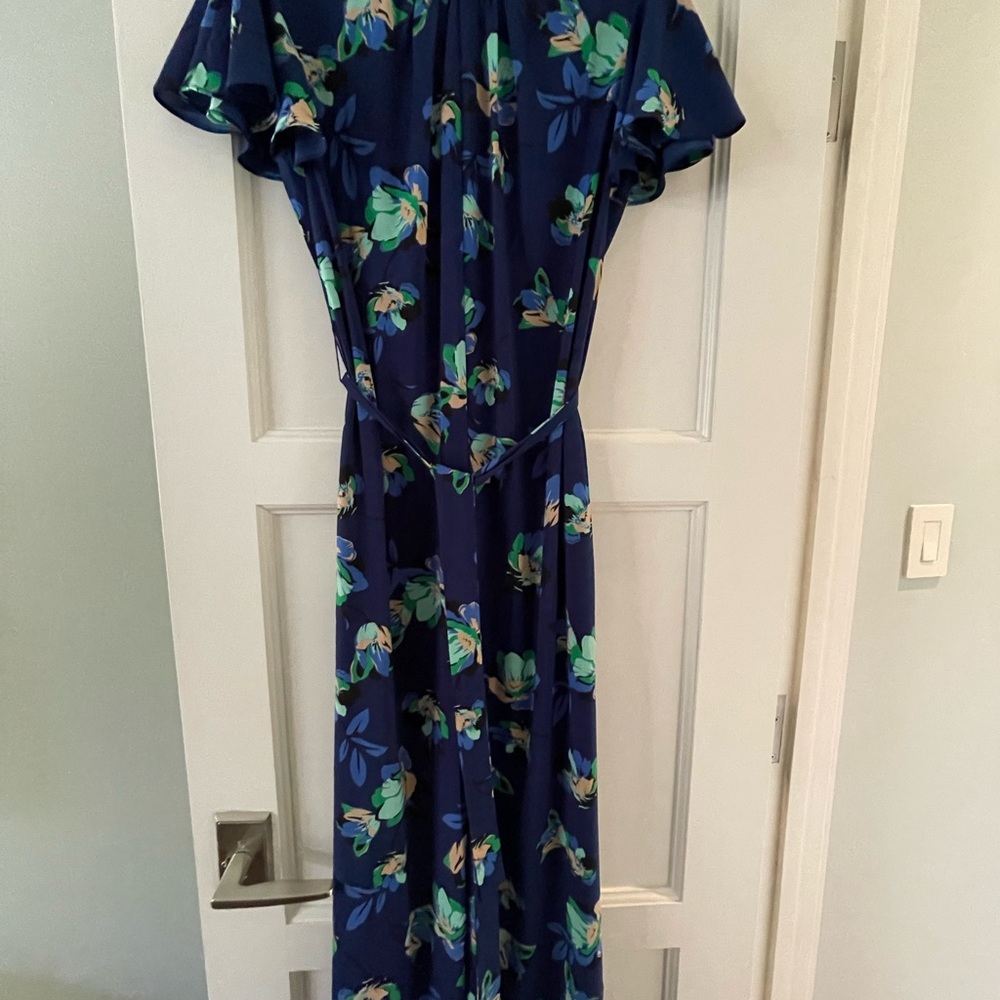 Adorable Pantsuit with zipper closure and tie waist.